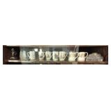 Shelf lot of misc mugs glass and crystal