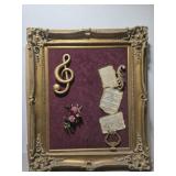 Large gold framed musical style artwork