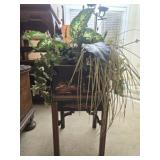 Asian style footed planting pot with faux plants