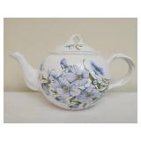 Vintage teapot featuring a blue floral design