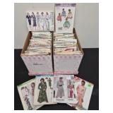 2 boxes full of vintage sewing patterns