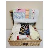 Wicker basket full of baby doll clothes