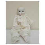 vintage baby doll featuring a porcelain