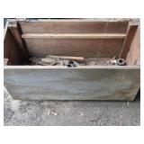 Old wooden box with parts and tools