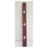 Vintage red wooden carpenters level