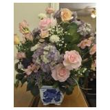 Faux flowers arrangement in blue & white vase