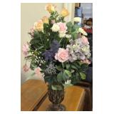 Faux flowers arrangement in metal vase