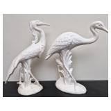 Unpainted white ceramic heron sculptures