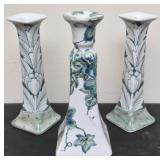 Green and white floral candle stick holders