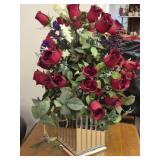 Faux flower arrangement in mirrored vase