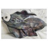 Metallic wall sculpture shaped like a fish