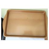 4 copper colored non-stick baking sheets