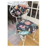 White metal chair with cushions