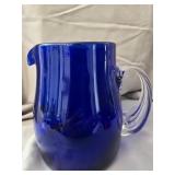 Hand Blown Cobalt Blue pitcher has a makers mark