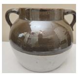 Light brown and white pottery crock