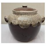 Brown and white crock with lid