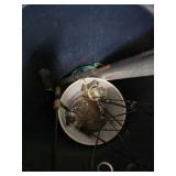 Trash Can with Lot Of Fishing Poles Reels