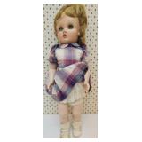Vintage doll with box of doll clothes