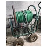 Garden hose on metal cart