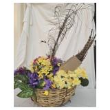 Basket with floral decor and feathers