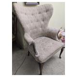 Wood and upholstered wingback chair
