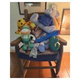 Child's wooden rocking chair with stuffed animals