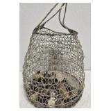 Metal basket with copper cabinet knobs