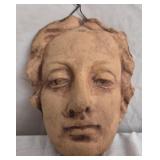Clay pottery face sculpture