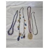 4 necklaces a couple are blown glass