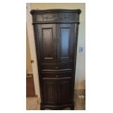 dark finished wood cabinet content not included