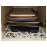 Shelf of Metal Baking Pans Griddle Cutting Boards