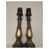 Pair of candle stick holders with candles