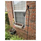 Shepherds hook and plant stand and flower pot