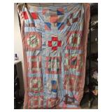 77" by 45" red and blue multi colored quilt