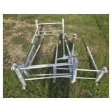 Lot of 4 plastic and aluminum clothes racks