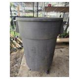 Plastic trashcan on wheels