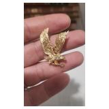 14k gold flying eagle pendant marked 14k