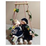 Super cute porcelain kissing dolls on swing 23"