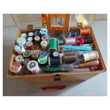 Antique plastic sewing box full of sewing notions