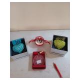 Four Christmas ornaments, one is mikasa, one is a