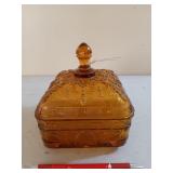 Amber glass candy dish with be motif,