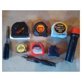 Asst tape measures, large drill bit, chisel,