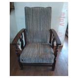 Old wooden reclining chair, has some rat holes