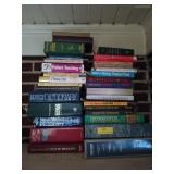 2 stacks of assorted books on air conditioning