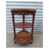 Round mahogany carved table 29x20