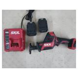 Skil cordless reciprocating saw, charger and two