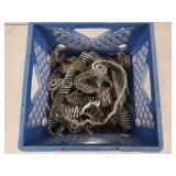 Plastic milk crate half full of roofing nails