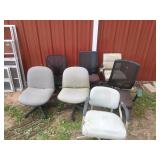 Seven rolling office chairs