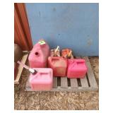 Five fuel cans 1 to 5 gallon