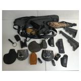 Plastic tub of asst holsters, butt stocks,